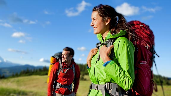 A couple hiking and camping.