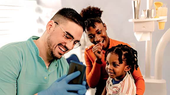 A group of happy dental practitioners in a Dentist's office.